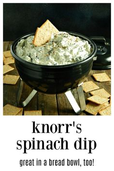 a bowl of dip with crackers in it and the words knorr's spinach dip great in a bread bowl, too