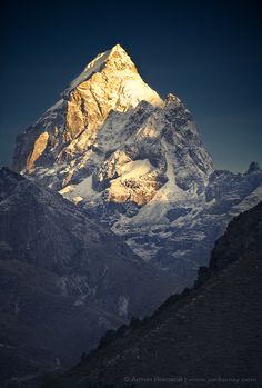 the top of a mountain with snow on it