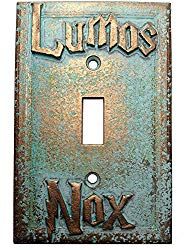 a light switch cover with the words lumos and nox on it