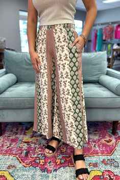 Unleash your inner babe with the NAOMI Wide Leg Pants in Olive. These flowy pants are perfect for these transitional days, with a light weight design that keeps you cool and comfortable. The pattern adds a touch of whimsy to your wardrobe. Step into these stylish pants and let your free-spirited energy shine! Model is wearing a small and 2X. Material: 100% Rayon Sizing: Small: 2/4 Medium: 6/8 Large: 10/12 Bohemian Wide-leg Patterned Pants, Bohemian Wide-leg Rayon Pants, Bohemian Printed Wide-leg Pants, Wide-leg Floral Print Lounge Pants, Spring Wide-leg Paisley Print Pants, Flowy Pants, Stylish Pants, Candles For Sale, Lounge Sets