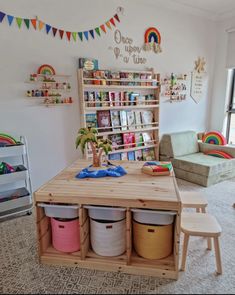 a child's playroom with toys and bookshelves