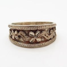 925 Sterling Silver Ornate Floral Design Ring Size 8 3/4Weight: 4.0gWELCOME TO PAWN SHOPWe are an actual pawn shop and have been in business for over 25 years.Since 1990, our establishment has been serving a variety of clients by providing them with short term cash solutions and options of liquidity regarding their treasured heirlooms.Acknowledging that today′s customers are very sophisticated and are looking for a variety of investments, our acquisitions are hand-picked for our special clientel Heirloom Silver Flower Ring For Anniversary, Heirloom Style Silver Flower Ring For Anniversary, Nickel-free Heirloom Rings For Anniversary, Heirloom Nickel-free Rings For Anniversary, Antique Silver Toe Ring, Vintage Sterling Silver Wide Band Jewelry, Silver Heirloom Wide Band Jewelry, Vintage Silver Flower Ring Stamped 925, Antique Silver Ornate Rings For Anniversary