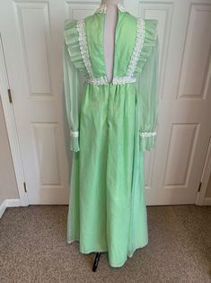 This nice vintage 1970's Mint green & white Swiss Dot and Lace Pinafore dress comes to you in a size small. The dress is a high waist style fully lined-has sheer sleeves and giant ruffle at bottom with lace trim-Has the Pinafore Front-In great vintage cond-Pls compare the measurements I give you to those in your closet-They are as follows- -14 3/4 to 15 inches shoulder to shoulder -25 1/2 inches shoulder to bottom of sleeve -waist is 14 inches across -hips N/A -49 inches underarm to bottom o 70s Prairie, Camano Island, 70s Inspired Fashion, Pinafore Dress, 70s Inspired, Inspired Fashion, Swiss Dot, Sheer Sleeves, Mint Green