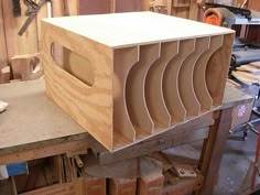 a wooden box sitting on top of a workbench