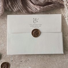 an envelope with a wax stamp on it