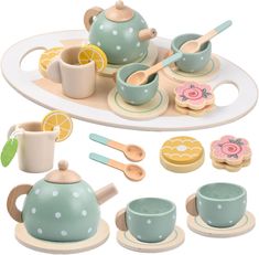 a toy tea set on a tray with lemon slices and other items to make it look like they are made out of wood