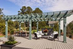 an outdoor living area with patio furniture and pergolated roof