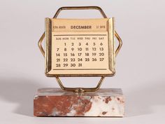 a marble block with a calendar on it