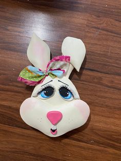 a close up of a stuffed animal on a wooden floor