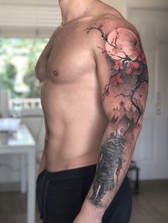 a man with a tattoo on his arm