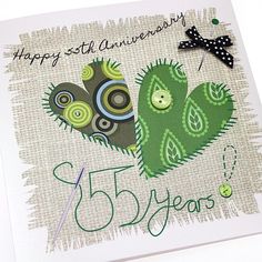 a happy 25th anniversary card with two green cactuses and a black bow on it