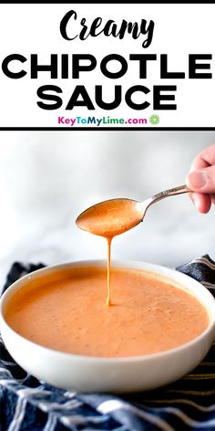 creamy chipotle sauce being drizzled over a bowl with a spoon