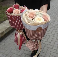 a person on a bike with flowers in the basket and ribbons tied to it's handles