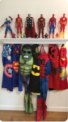 there are many superheros on the shelf