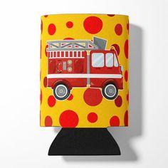 a red fire truck on yellow polka dot paper