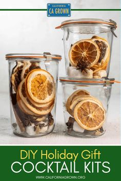 three glass containers filled with sliced oranges and spices