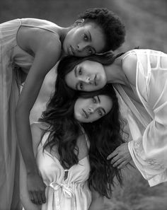 two women are posing for a black and white photo with their arms around each other