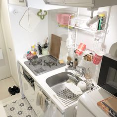 a small kitchen with a sink and stove