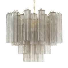 a chandelier made out of glass tubes on a white background with gold trimmings