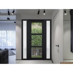 an open door leading to a living room with white walls and black trimmings