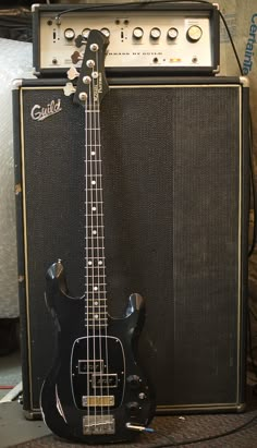 an electric guitar and amp sitting next to each other