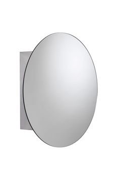 a round mirror mounted to the side of a wall