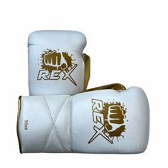 two white boxing gloves with gold trims and fist prints on the front, one has a