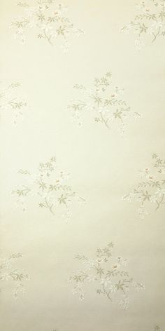 the wall paper has white flowers on it