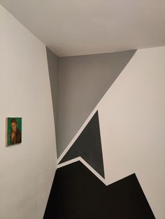 the corner of a room painted with black and white paint