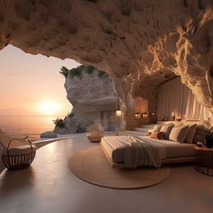 a bedroom with a large bed in the middle of it next to an ocean view