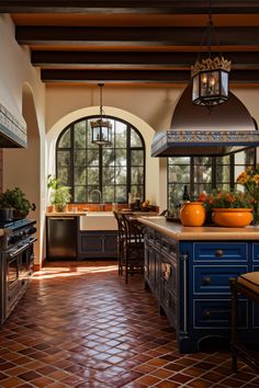 a kitchen with blue cabinets and tile flooring