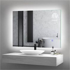 a bathroom with a sink, mirror and radiator