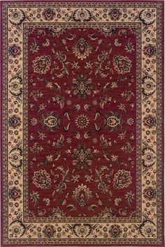 a red and beige rug with an ornate design on the center, surrounded by flowers