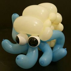 a blue and white balloon octopus with large eyes