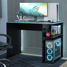 a computer desk with a monitor and speakers on it