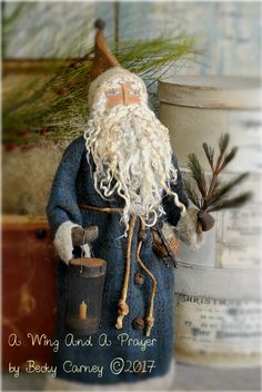 a gnome figurine sitting next to a potted plant