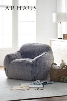 a large bean bag chair sitting on top of a rug