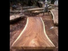 a man is working on a wooden bench