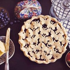 an image of pies and other desserts on the table with utensils