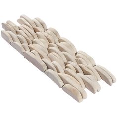 a bunch of white toothpicks sitting on top of each other in front of a white background