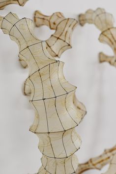 a sculpture made out of wood and wire