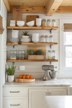 a kitchen with open shelving and wooden shelves