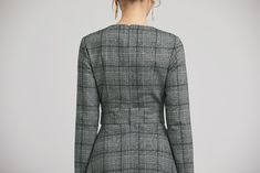 "Retro wool plaid long sleeves dress in classic hues of gray, black and white. This dress features a round neckline,fitted waist, fully lined and a back zipper closure. Details: * plaid wool fabric with fully polyester lining * long sleeves * round neckline * back zipper closure * no pockets * knee length * with buttons decoration * womens dresses, winter dress SIZE GUIDE Size vary between Brand and Country Please get your body measurement with our Size Guide And Find your size in our Size Chart Long Sleeve Plaid Dress For Work, Winter Plaid Fitted Dress For Work, Plaid Tweed Dress For Office In Fall, Plaid Midi Dress For Work, Chic Plaid Midi Dress For Fall, Elegant Plaid Dress For Workwear In Fall, Plaid Midi Length Dress For Work, Elegant Long Sleeve Plaid Dress For Work, Fitted Plaid Dress For Winter Workwear