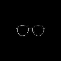 a pair of glasses on a black background