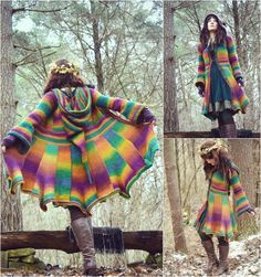 the woman is wearing a multicolored sweater and boots in front of some trees