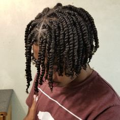 a man with dreadlocks is brushing his teeth