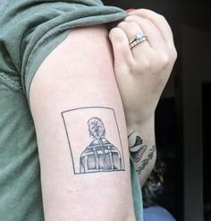 a person with a tattoo on their arm