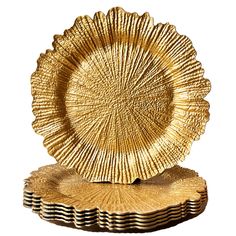 a gold plate sitting on top of a wooden stand