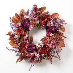 a wreath made out of flowers and leaves