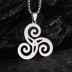 🌀 Embrace the ancient power of Celtic spirituality with our enchanting Spiral Celtic Witch Necklace. Crafted from high-quality stainless steel, this captivating pendant features a beautifully detailed spiral design - a sacred symbol representing the cyclical nature of life, the elements, and the divine feminine. This pagan wiccan jewelry piece pays homage to the rich traditions of Celtic witchcraft, honoring the mystical energy of the spiral as a portal to the otherworld. The spiral motif is a powerful representation of the goddess, transformation, and the interconnectedness of all things. Whether you're a practicing witch, a pagan devotee, or simply someone drawn to the mystical energy of Celtic symbolism, this stainless steel necklace is a must-have accessory. Wear it as a symbol of you Celtic Witchcraft, Celtic Spirituality, Celtic Symbolism, Triquetra Jewelry, Celtic Witch, Sacred Spiral, Wiccan Necklace, Witch Necklace, Magical Accessories